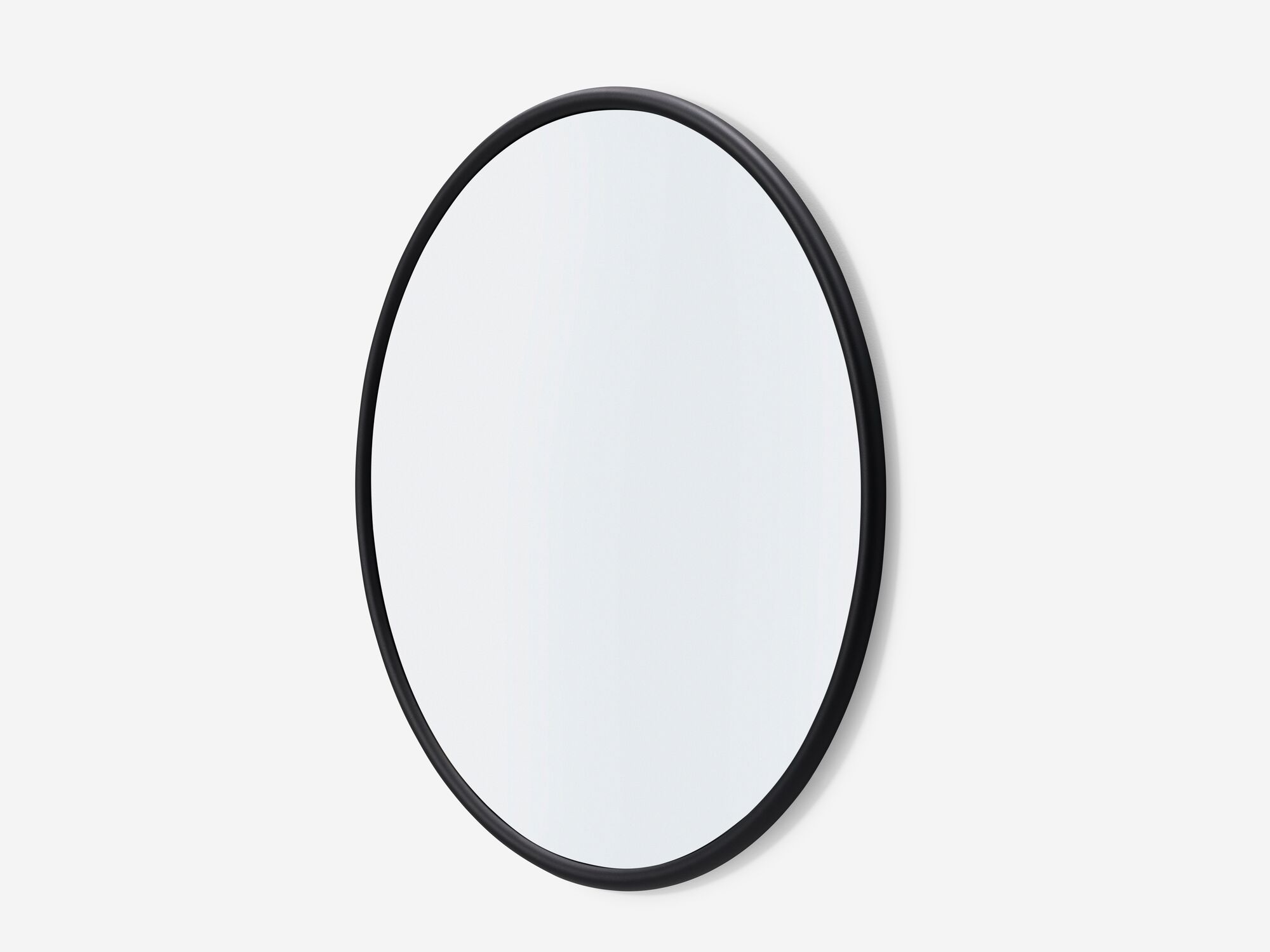 Round wall mirror with black edge front angle view